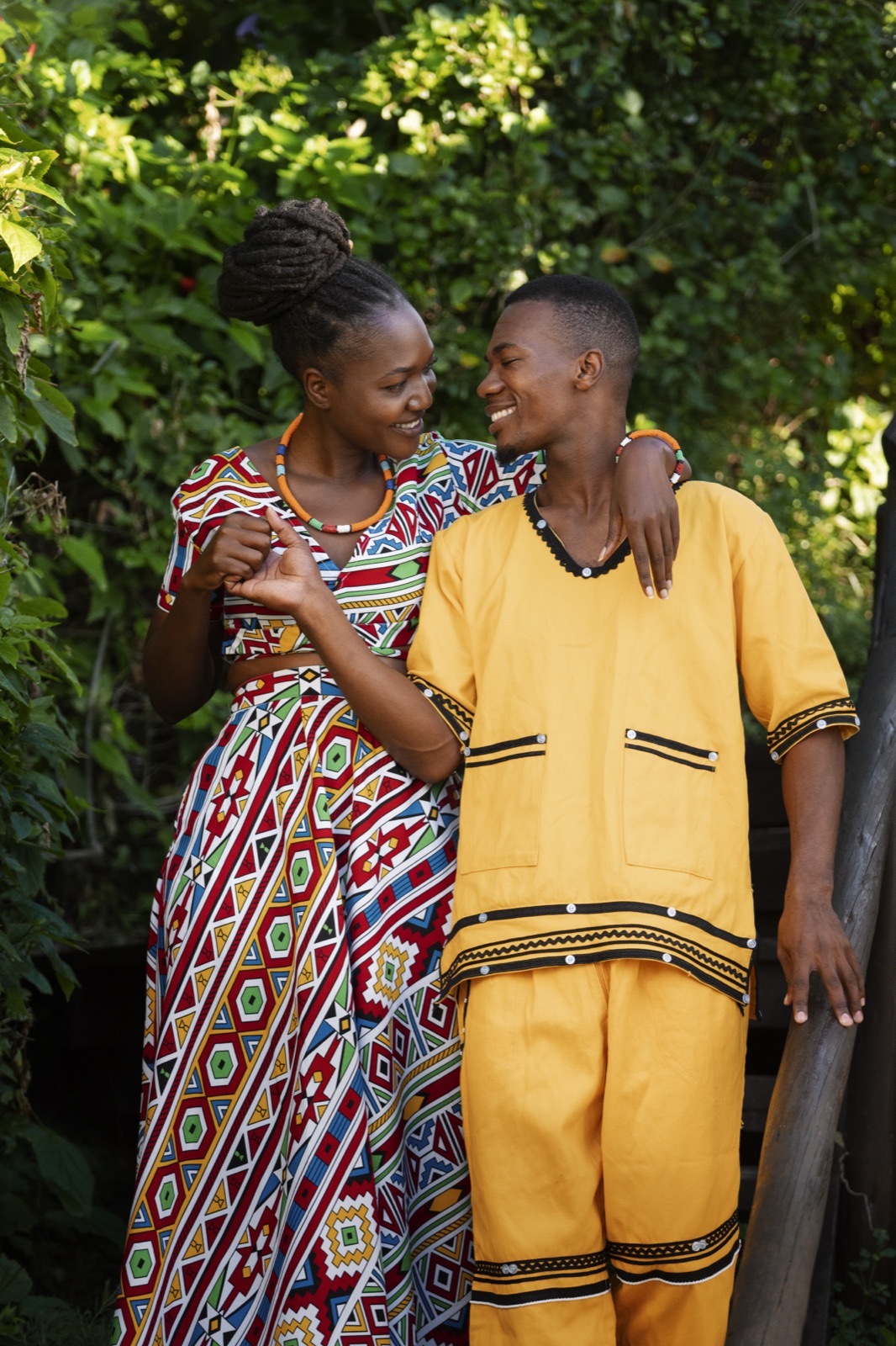 Nia and Kamau walking arm in arm